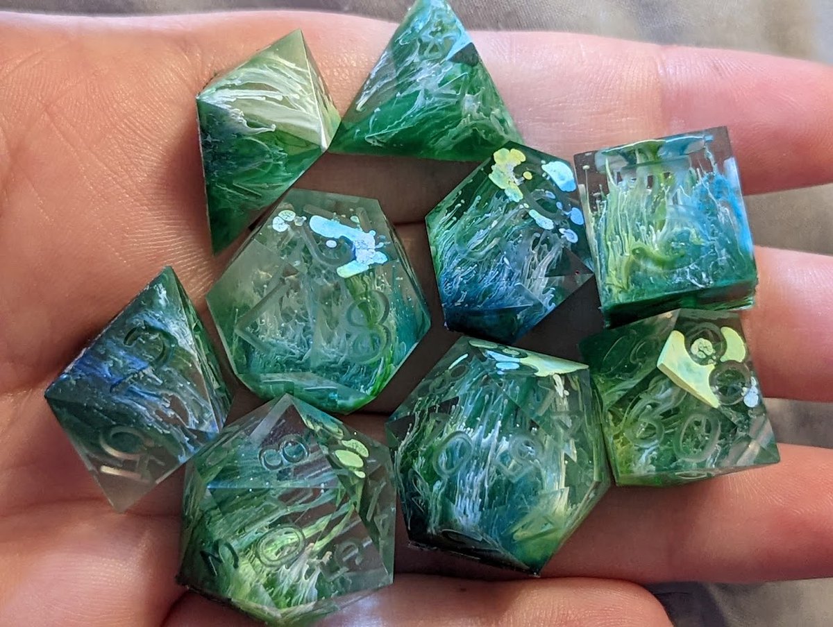 FishMakesDice's tweet photo. Pull of the day! These were meant to look sort of oceany and think that it worked pretty well. I'm pleased with them. :3 

#handmadedice #dice #dicemaker #ttrpg #dnd #dungeonsanddragons #diceset #dnddice #resin #resinart #mathrocks #petri https://t.co/YB5sRlXhKQ