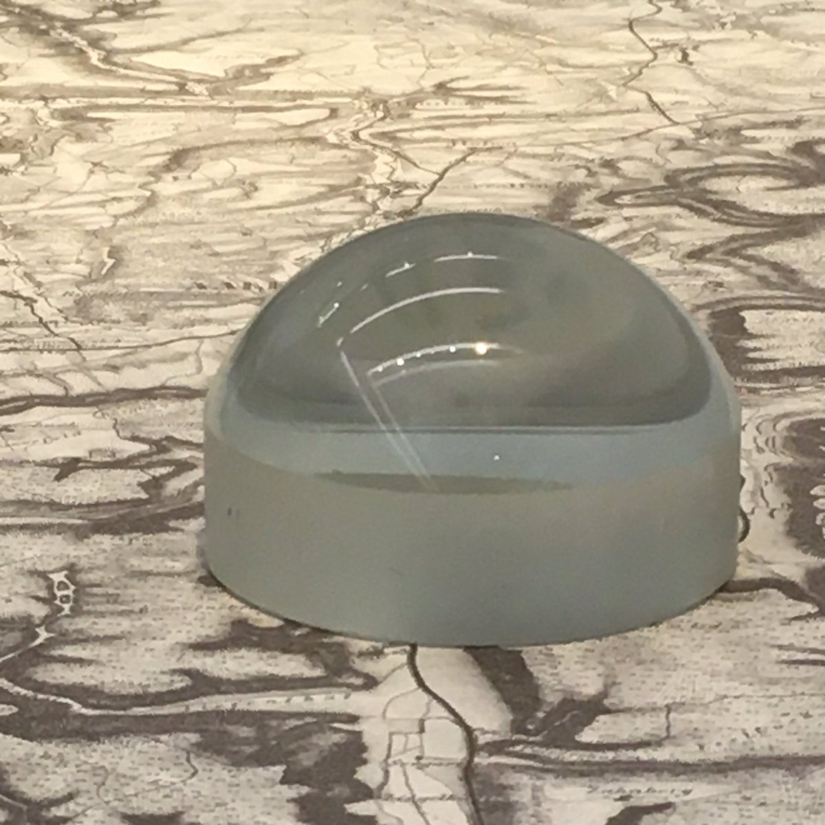 Ulrike_Boehm's tweet photo. Do you know what a #ReadingStone is? It’s a hemispherical lens that can be placed on top of text to magnify it so that people with #presbyopia can read it more easily 🧐 They were among the earliest common uses of lenses (~1000 AD). Photo: Reading Stone at #Zeiss in #Oberkochen https://t.co/vXL1eCgqUD