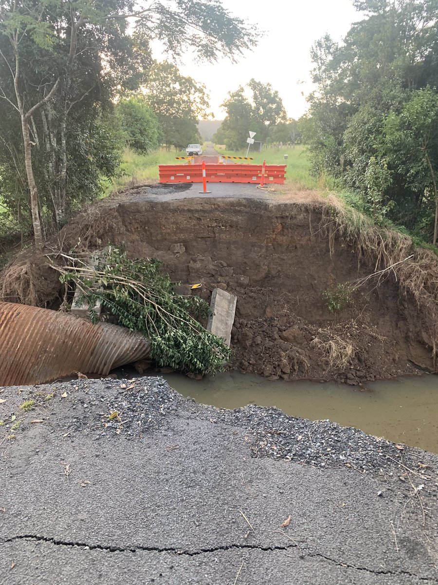 Anthr0pocalypse's tweet photo. Seeing the state of the roads around Lismore really puts into perspective the volume and violence of water that was coursing its way into town on the night of the historic flood.

Keerong Road was already bad but now it’s impassable. 

The cost of climate inaction is stacking up. https://t.co/8VUNIukbUJ