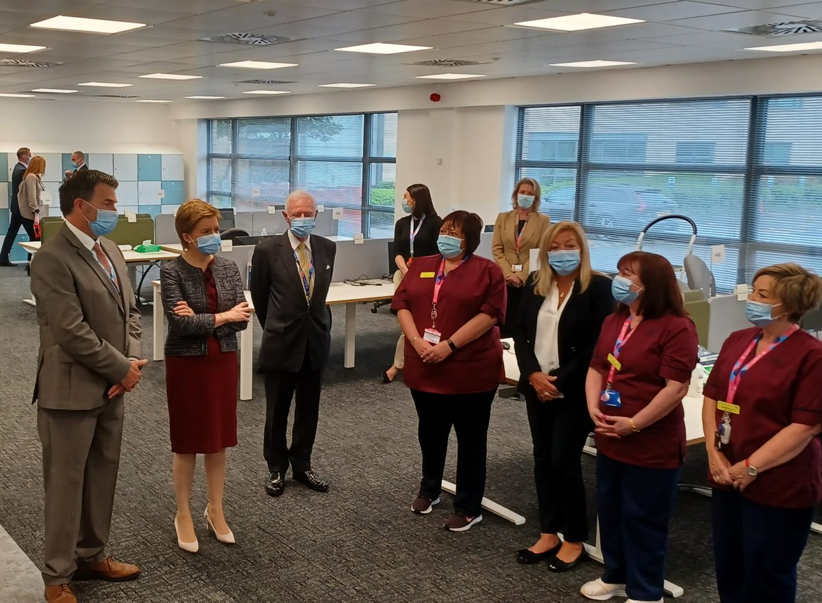 ScotGovFM's tweet photo. On the 20th anniversary of @NHS24, First Minister @NicolaSturgeon praised staff for their commitment and tireless effort to ensure the public have access to the right information and support as she officially opened a new centre for the service in Hillington this morning. https://t.co/gckcpjCaMe