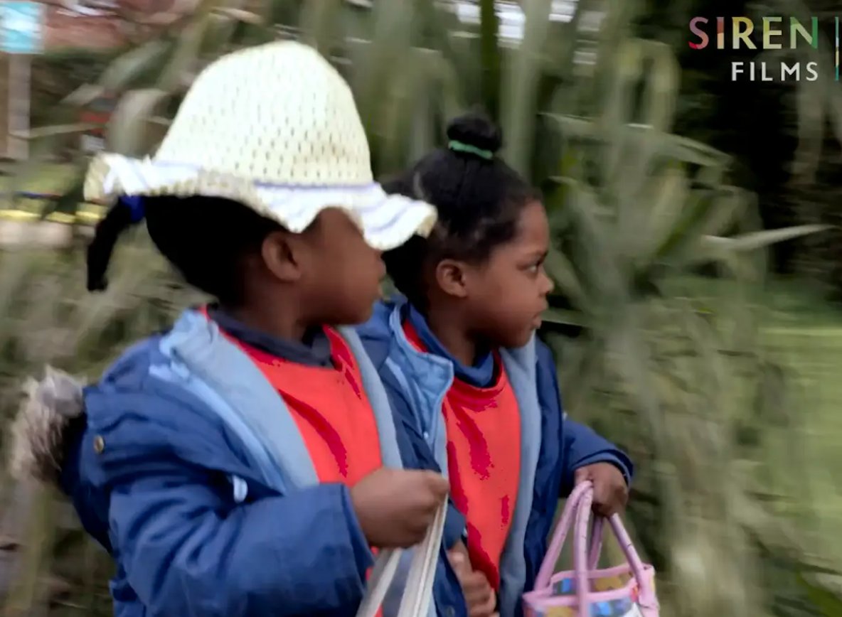 SirenFilmsLtd's tweet photo. Where's my hat?? Victoria and her twin sister Angelina have found themselves a hat and bag each and are going off for a wander round the garden. https://t.co/DVWsj7v238 #earlyyears #SEND #adultsupport #eymatters #eytalking #eytagteam https://t.co/raeF9kOjV3