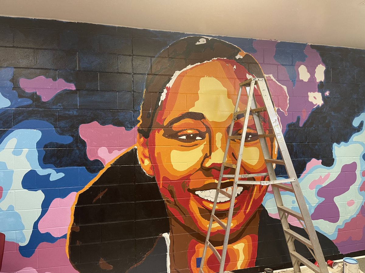 CincyPD's tweet photo. In the summer of '20, Police Cadet Aurora McCarter tragically lost her life to gun violence. In July of '21, a room at our Youth Services Unit building was dedicated to Aurora. The room was painted by local artists w/ the input &amp; help of our cadets to honor Aurora @Brentlavelle1 https://t.co/hVzEj9mXAF