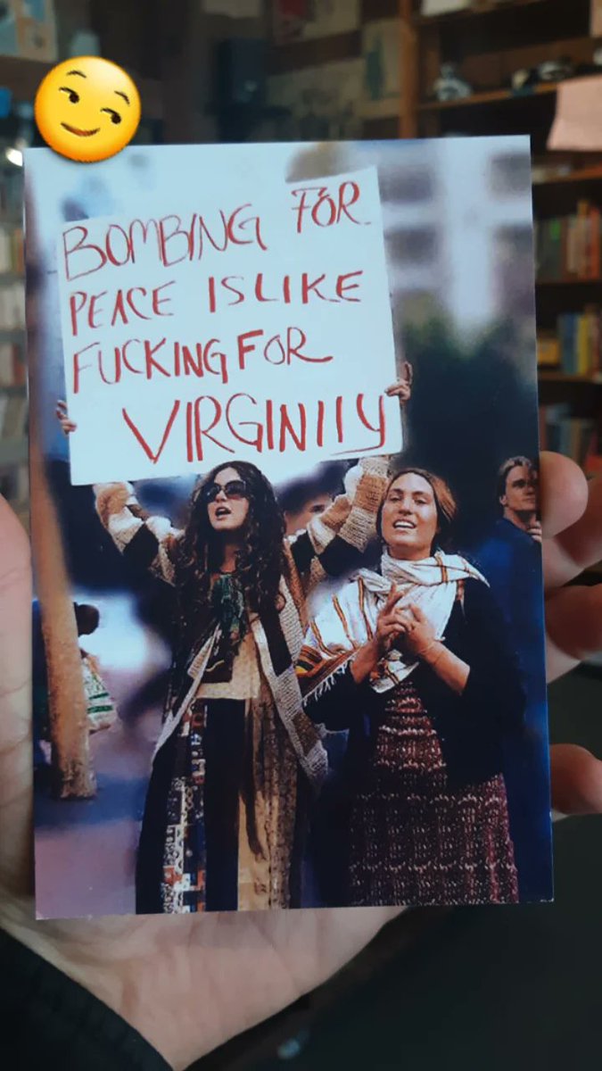 If you are looking for these things, you might like Bound Together Bookstore:

1. Postcards with funny &amp; insightful commentary 
2. Cheeky &amp; Bawdy Humor in relationship to important historical moments
3. Inexpensive Postcards
4. Volunteer collective bookstores w/ anarchist media