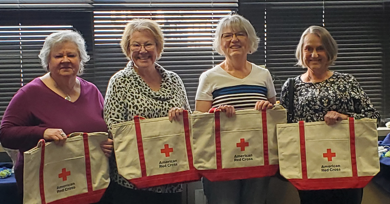 RedCross's tweet photo. Let’s give it up for this talented group of knitters, who have been knitting hats, gloves &amp; scarves for military families for 11 years. Together, they’ve donated over 2,000 sets of knitted items! 👏🏾👏🏼👏🏽 Learn more about this team of @RedCrossIL volunteers:
