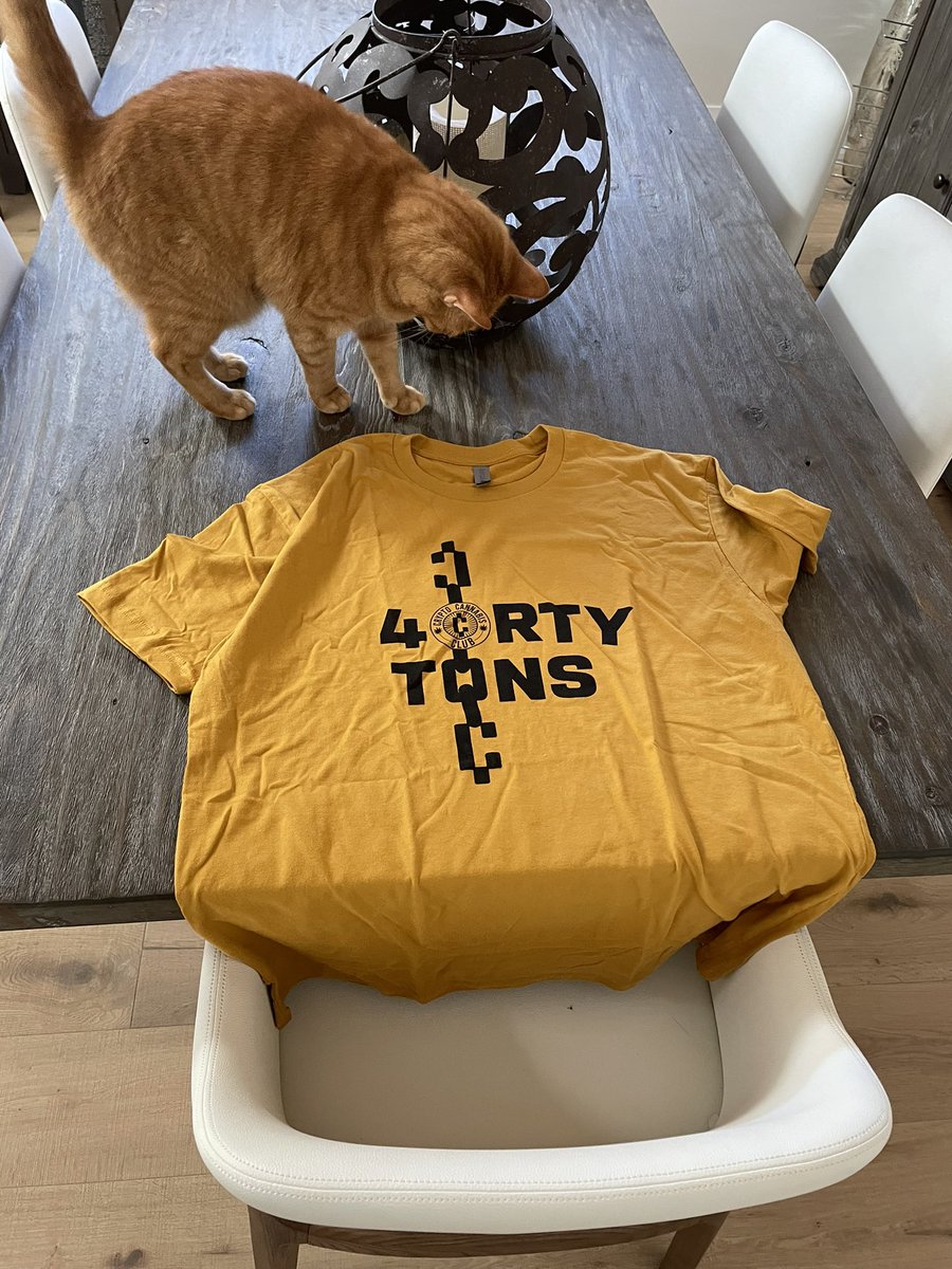 SeanSpartan's tweet photo. The @40TonsBrand X @CryptoCannaClub tee arrived - even my own little cub, Boo, wanted to check it out! #CCC #40TonsBrand love the color! https://t.co/ZVTNLMlJmt