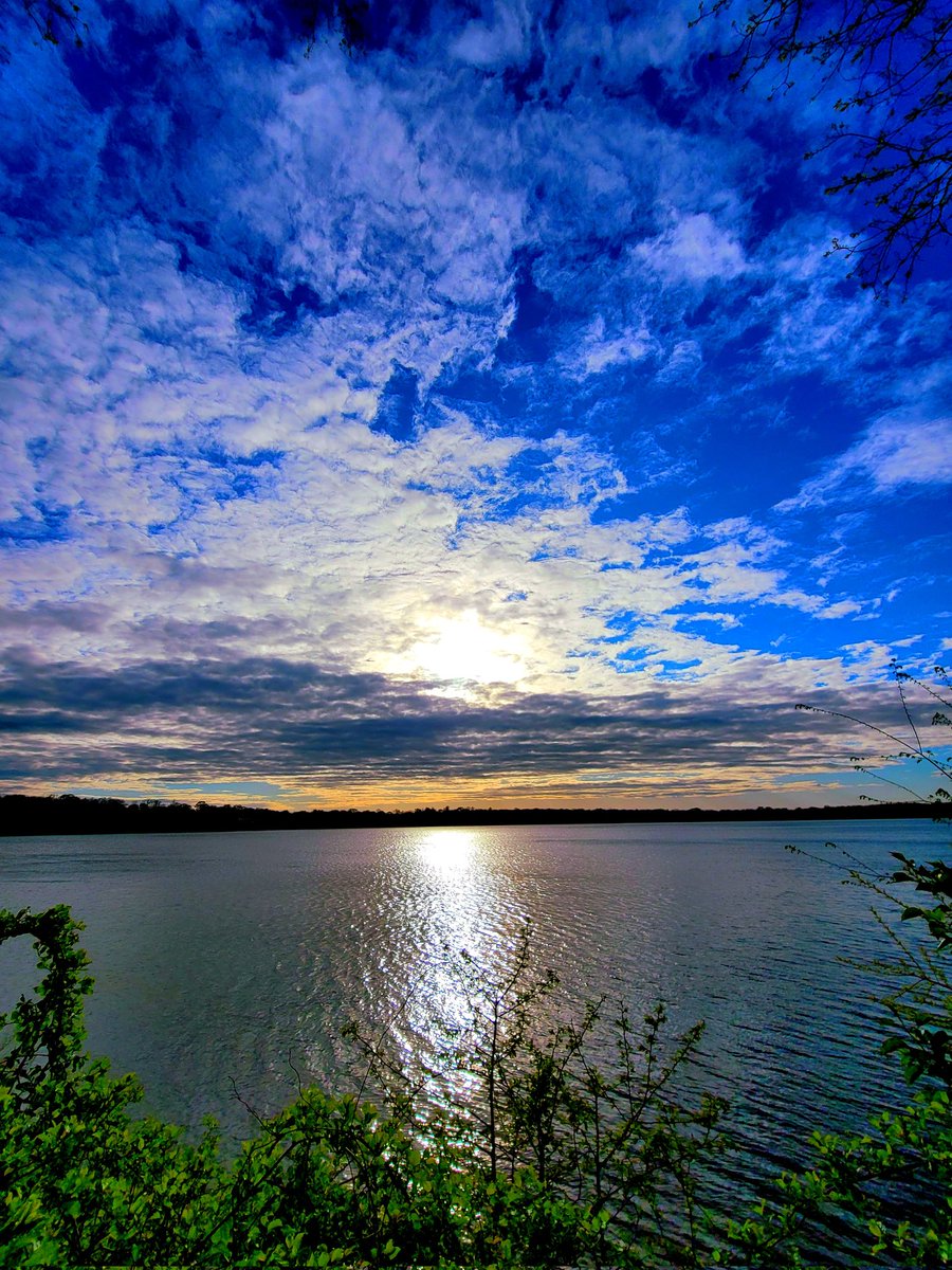 maribe11a's tweet photo. tonight she is a blur of blue electricity #sunset #lakeside https://t.co/lmvto74SZv