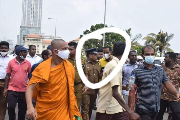 Government MP Sanath Nishantha pictured with Senior DIG Deshabandu Tennakoon yesterday when Rajapaksa supporters stormed the Galle Face protest