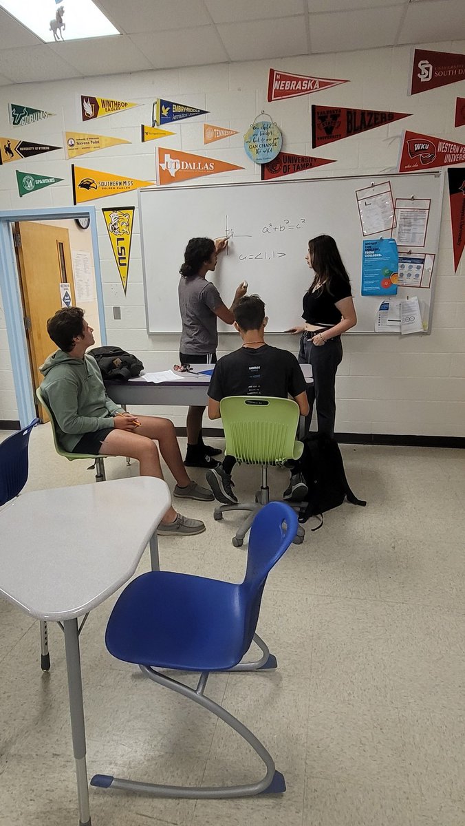 MrsDAversaAVID's tweet photo. Some kiddos teaching/learning/studying for math during lunch today. 💪🤍🐺💙 #ilovemyjob @DHSHappenings https://t.co/ZZU7GQPtep