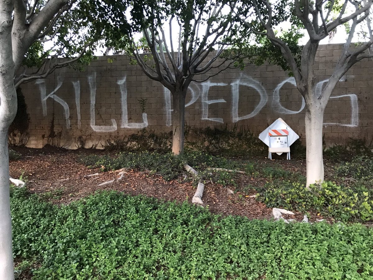 MagicAndWalnut's tweet image. Shocking “KILL PEDOS” graffiti has popped up along a @Disneyland Resort wall facing Walnut Street — possibly linked to the far-right protests last month on Harbor Blvd. The concrete wall surrounds the main #DowntownDisney parking lot.