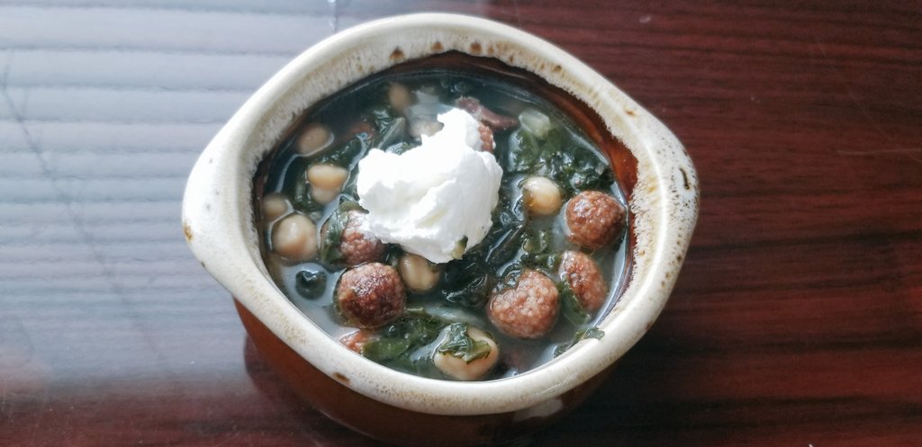SunnyDietitian's tweet photo. Tonight's dinner: Borani, a swiss chard and chick pea delight with mini kufteh bulghur meatballs, topped with a dollop of yogurt and some garlic. Yummy. Comfort food. #ArmenianCuisine #ComfortFood #HealthyEating #NutrientPacked https://t.co/VDMBCEN4vv