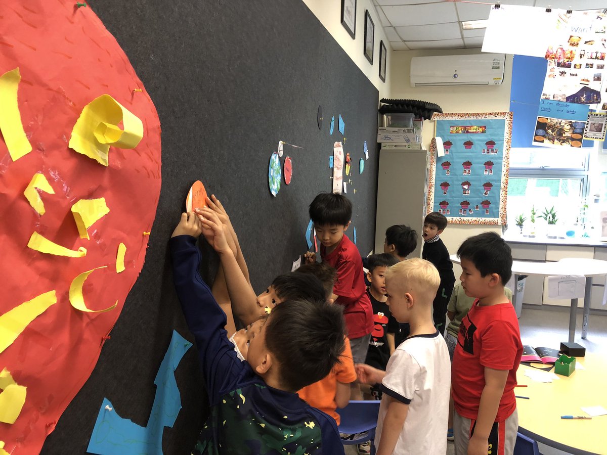 Debbiemcolwill's tweet photo. During our #HTWW unit, I love giving sts @AISGZ the freedom to research the solar system and decide how they want to create it in the classroom. Then, they will continue to add to it as they learn more. The US flag on the moon is hands-down my favorite addition yet! https://t.co/VggGIiLi9t