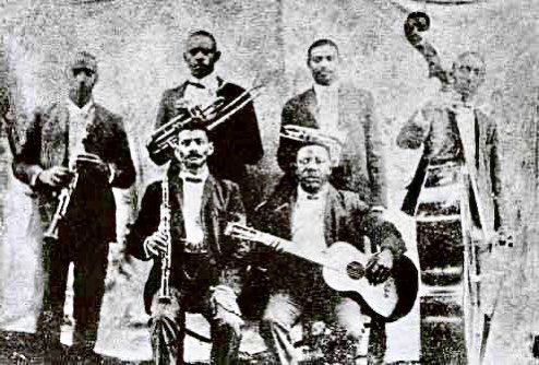 BUDDY BOLDEN ORCHESTRA, 1905, New Orleans

Bolden's band began as a string band led by guitarist, Charlie Galloway. Eventually it went from Galloway's band featuring Bolden to Bolden's band supported by Galloway's guitar. #buddybolden #blues #bluesmusic #musician