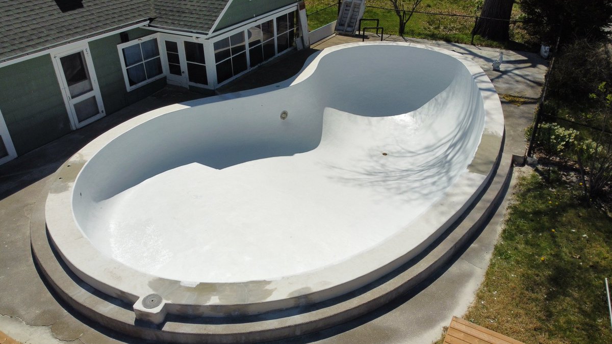 50's pool brought back to life. The top ledge and step are going rubber rock. Fort Erie, Ontario