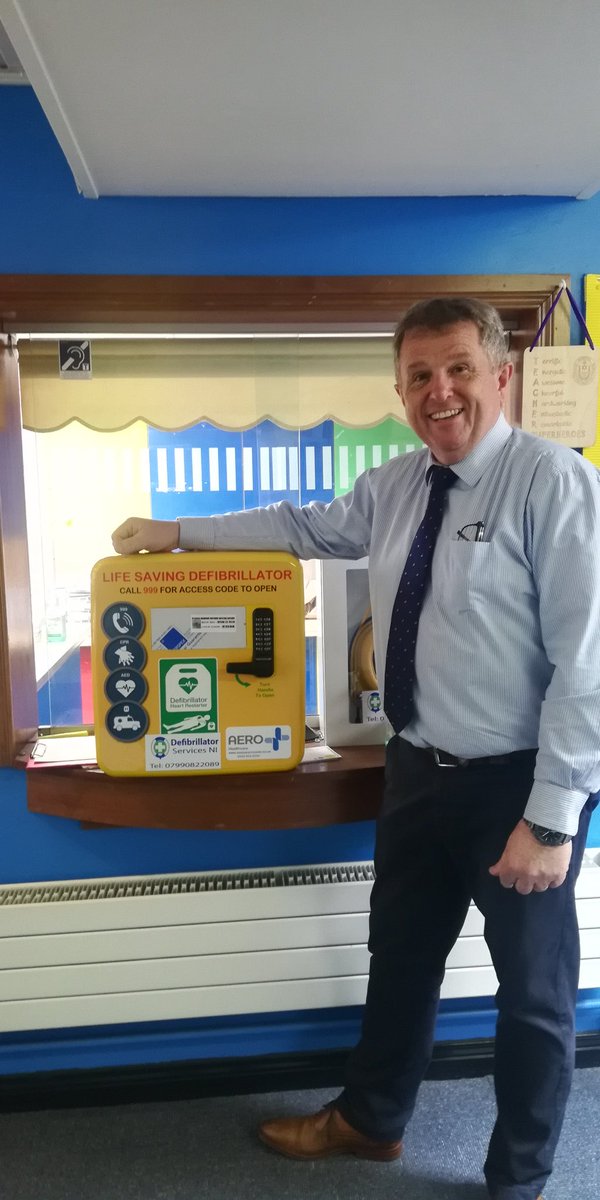 DefibSvsNi's tweet photo. Mr Henry #Headmaster of DH Christie Memorial #Primary #School @Coleraine with a #External #Heated #Keypad #Locked #Cabinet containing a #Heartsine #350p #Defibrillator, the #School raised #funds for this #Public #Access #Defibrillator for use by the #Local #Community https://t.co/h0CeKobsjJ