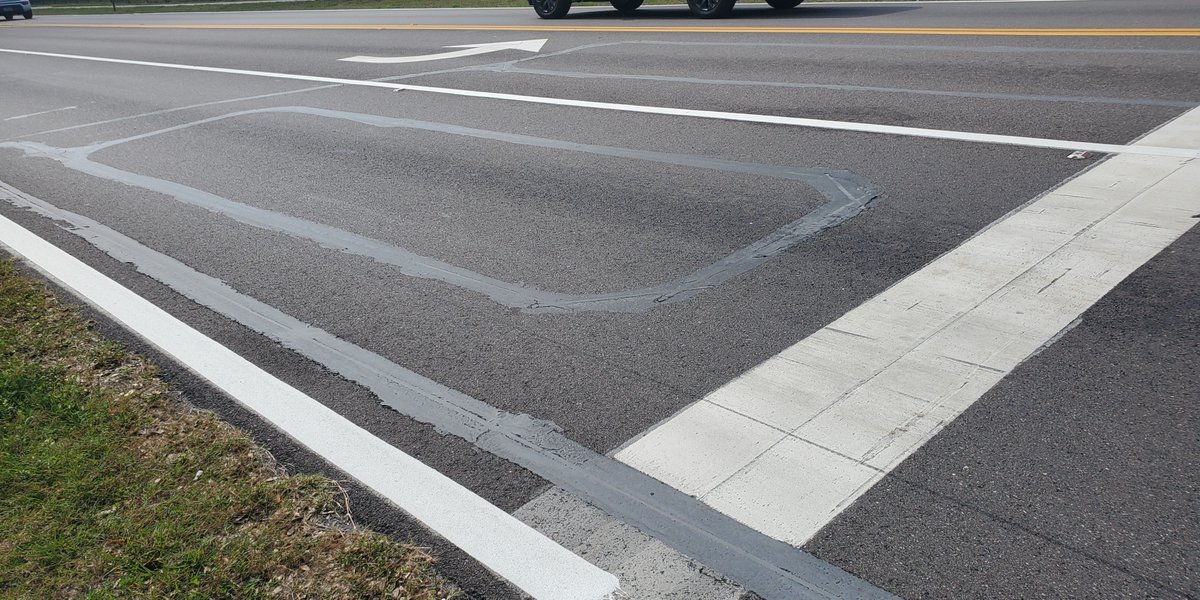 Have you ever been at a signalized intersection and wondered what those square cuts in the pavement are? They are called loop detection. There is a wire in the pavement that detects when a vehicle is waiting and communicates this to the signal. 1/2