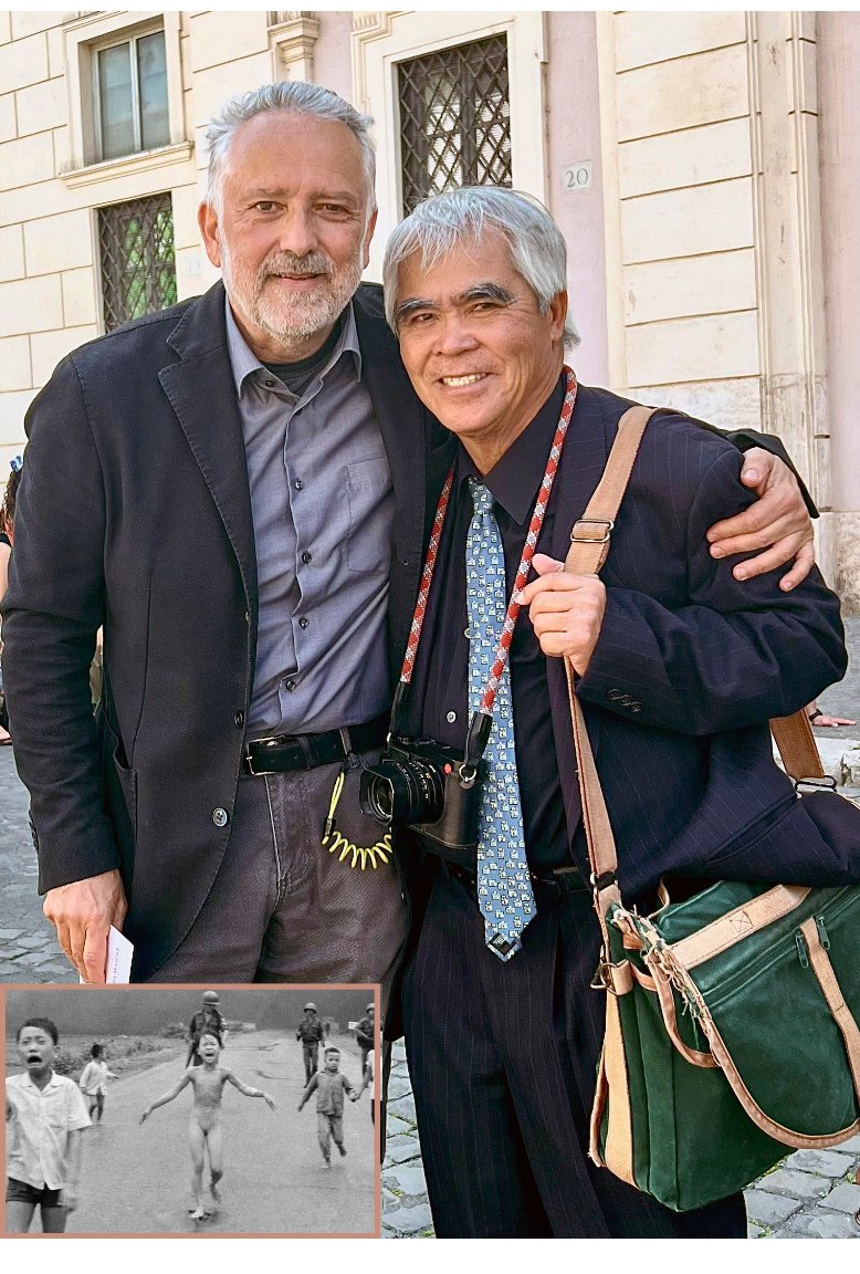 apdstinellis's tweet photo. #NickUt, the legendary retired AP photographer, #pulitzerprize winner for 1972 photo of 9-year-old Kim Phuc fleeing her village in Vietnam after a napalm strike, visited (camera around his neck) the Rome AP office on Wed. after he and Kim gave #PopeFrancis the photo. What a day!! https://t.co/7RZeuKQckM