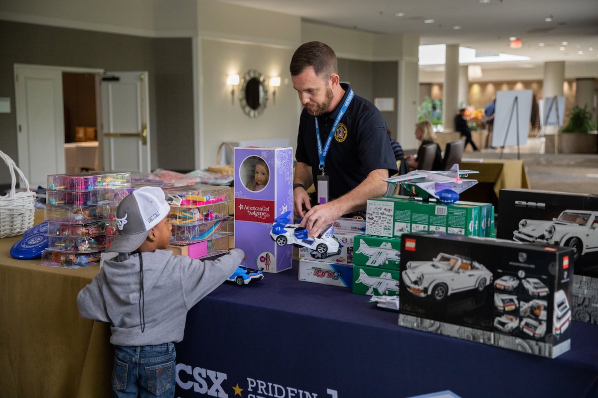 CSX's tweet photo. CSX police agents joined @nationalcops last week to speak with the children of officers who lost their lives in the line of duty and share items donated by @1strcf to help support these grieving families. #CSXPrideInService #NationalPoliceWeek https://t.co/7PeTWCiN4Y
