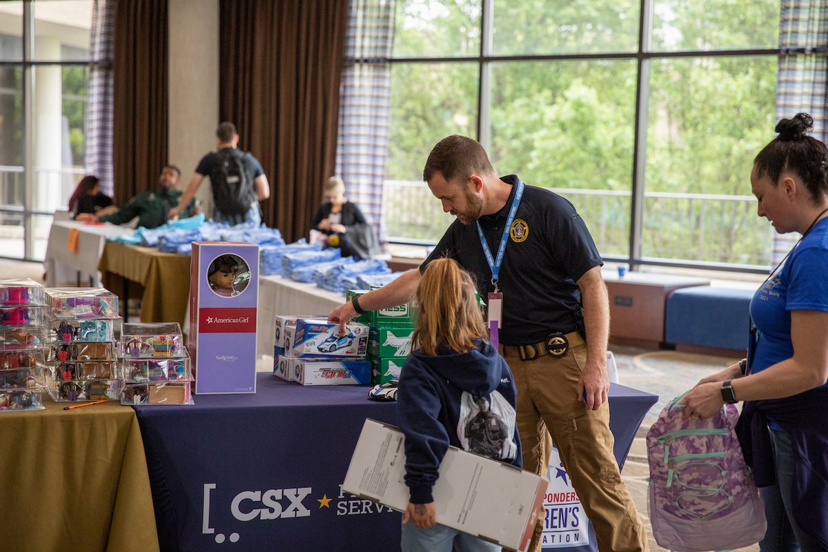 CSX's tweet photo. CSX police agents joined @nationalcops last week to speak with the children of officers who lost their lives in the line of duty and share items donated by @1strcf to help support these grieving families. #CSXPrideInService #NationalPoliceWeek https://t.co/7PeTWCiN4Y