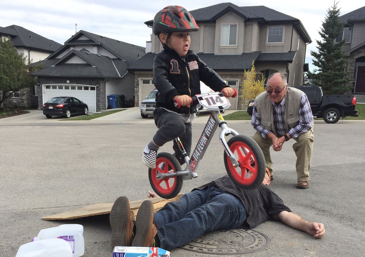 this dumbshit hasn't even figured out pedals yet and he's about to kill himself and his dad right in front of his proud pop pop