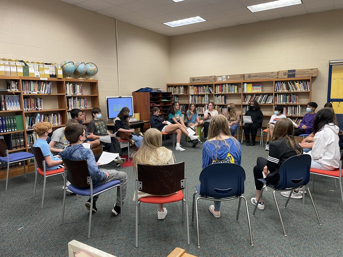 Grades 5-8 participating in Socratic seminar about Animal Farm