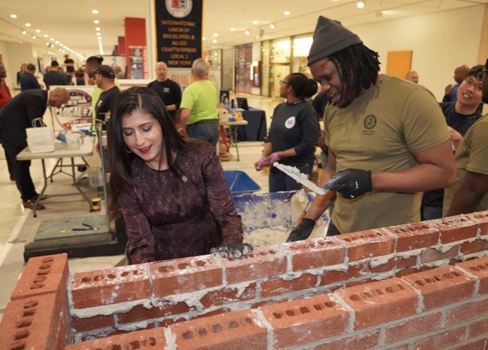 BricklayersNE's tweet photo. Always a champion for opportunity in the #1u Union Construction industry, Senator Ramos @jessicaramos  tries her hand with the #apprentice bricklayers at the @NYSBCT "Apprenticeship Works" event in Albany. https://t.co/iliCusDSXV