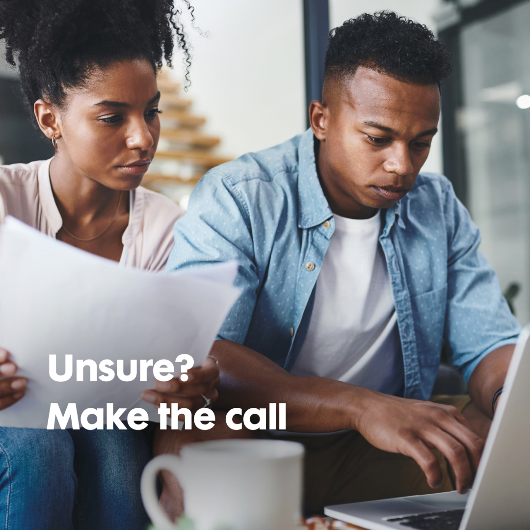 Couple looking at computer.