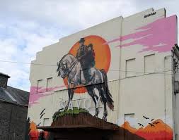 DiarmuidXCI's tweet photo. @kermodeandmayo + Into the West! A classic Irish film directed by Mike Newell. One iconic scene involves the young protagonists taking their horse to the cinema(!) which is beautifully remembered in this mural at the old cinema in Portarlington, Co Laois, where the scene was filmed! https://t.co/19yZ3aNL2i