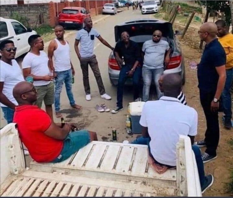 The guys sitting at the Benz: the one with the grey shirt is the owner  of the Benz and the guy sitting next to him, likes to take rides with him, and doesn’t pay for fuel
 
The guy in yellow: he doesn’t talk much and has short temper. Definitely eats a lot as well