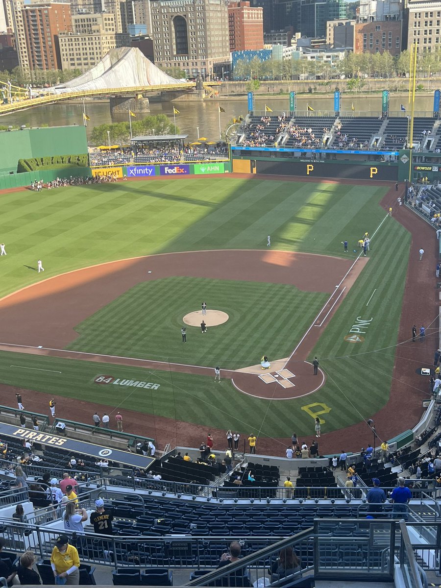 Demilio22's tweet photo. Hard to tell from up here, but that’s new Steelers WR Gunner Olszewski throwing out the first pitch prior to tonight’s Pirates vs. Dodgers game. 

He delivered a strike. https://t.co/ue1jN8Scmn