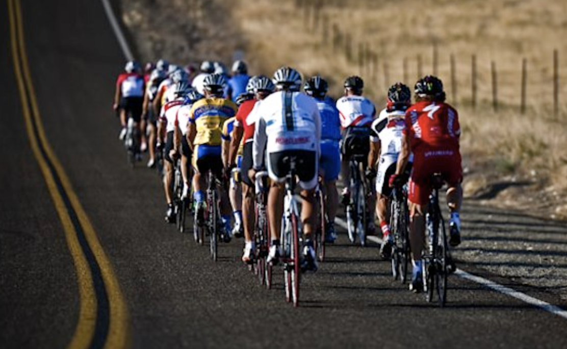 If this photo triggers you, is it because: a) The riders are doing something safe, fun & legal? b) The idea of waiting 15 seconds to pass is annoying? c) You've never seen 26 people take up so little room on a road? d) You doubt your driving ability? e) You have a spandex issue?