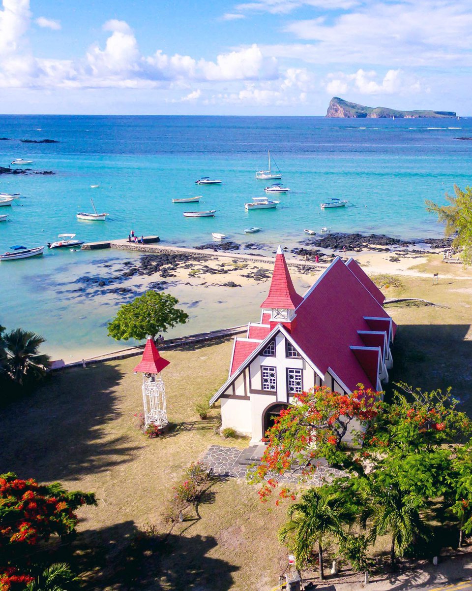 The church of Notre Dame Auxiliatrice is one of the most photographed sights on the island – its bright red roof pops against the background of blue sky, turquoise waters, and dramatic headland of Coin de Mire.
 
ow.ly/CORJ50J4Ihw 
 
#mauritius #travel #tourism