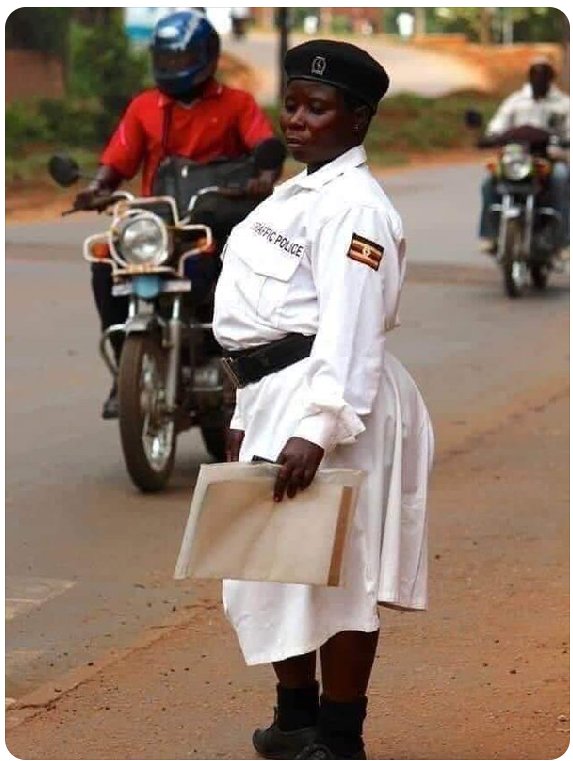 modi_juma's tweet photo. #KenyaVsUganda female traffic police officers. 
Where did the rain started beating Uganda. 
#Kenya police.     #Uganda police https://t.co/l0UXeqlngN