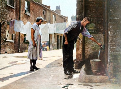 Knowledgepoint's tweet image. CAMBERWELL 1933.
There they were in Tiger Yard Camberwell on an early autumn morning in 1933 getting ready for work, out in the yard, at the only running water source available. Is she holding a toothbrush? Are they together or just neighbours?