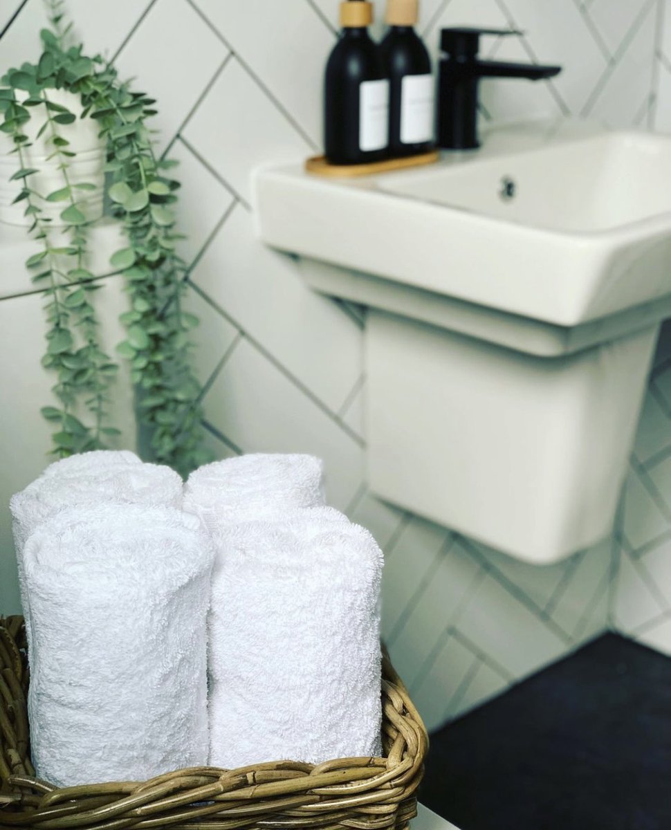 A crisp white wall tile can  be the perfect backdrop to your contemporary decor. Keeping the space feeling fresh and bright! 
This customer bathroom used the herringbone layout to add interest to the walls.