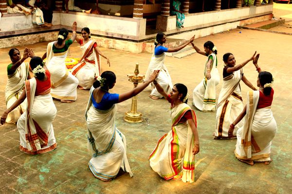 Onam is the perfect time to get your groove on in a traditional kasavu saree! These beautiful sarees have golden red or green borders and are often worn by women during the Onam #dance. The dance is performed around a lamp or Pookalam, with dancers making a circle around it. #nft