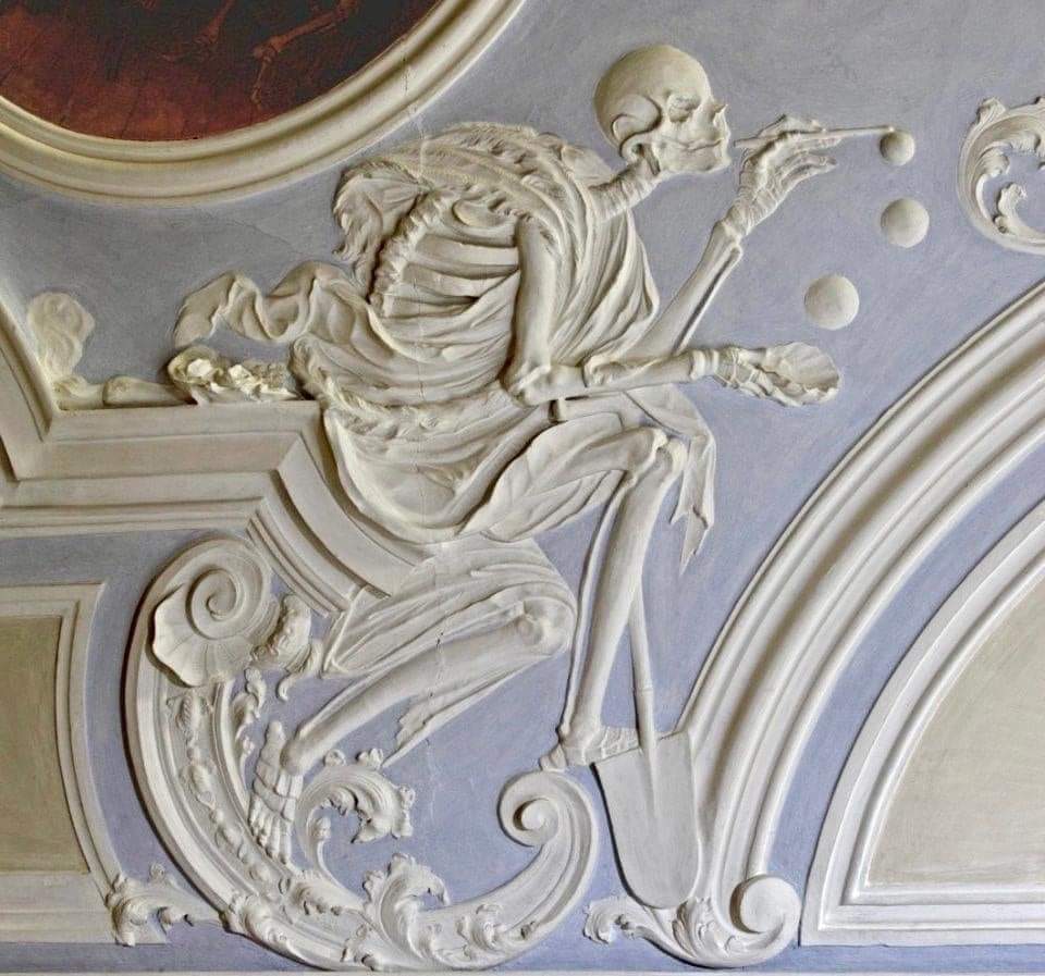 archeohistories's tweet photo. "Death blowing bubbles" 18th century. The bubbles symbolize life's fragility. This plaster work appears on the ceiling of the Holy Grave Chapel in Michaelsberg Abbey, Bamberg in Germany.

#archaeohistories https://t.co/S3vj4Y5Ej1