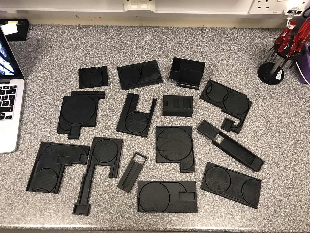 holliewrightre's tweet photo. All of the 3D printed prototypes our undergrad student made for his laser packaging project. Good thing we’re using recyclable material! 🤓 #UFOgroup https://t.co/Rib3lxQDds