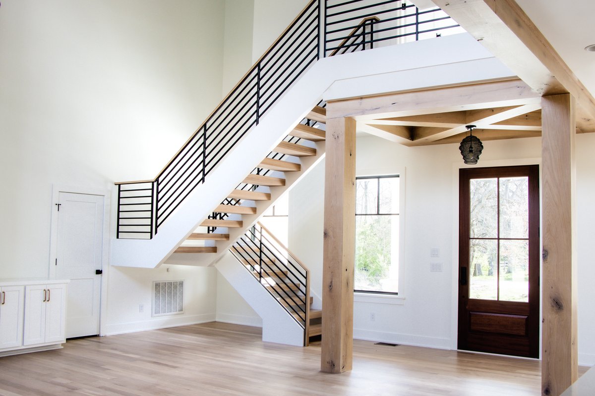 Southern Staircase recently installed this staircase and handrail system at a modern farmhouse in Brentwood, TN. The open rise stairs with horizontal railing provide clean, simple lines while maintaining the warmth and cozy feeling of the home. #customhome #customhomebuilder