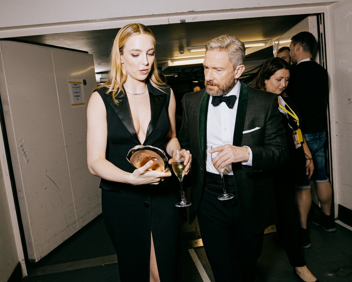 Jodie Comer talks to Martin Freeman backstage at the Virgin Media BAFTA TV awards