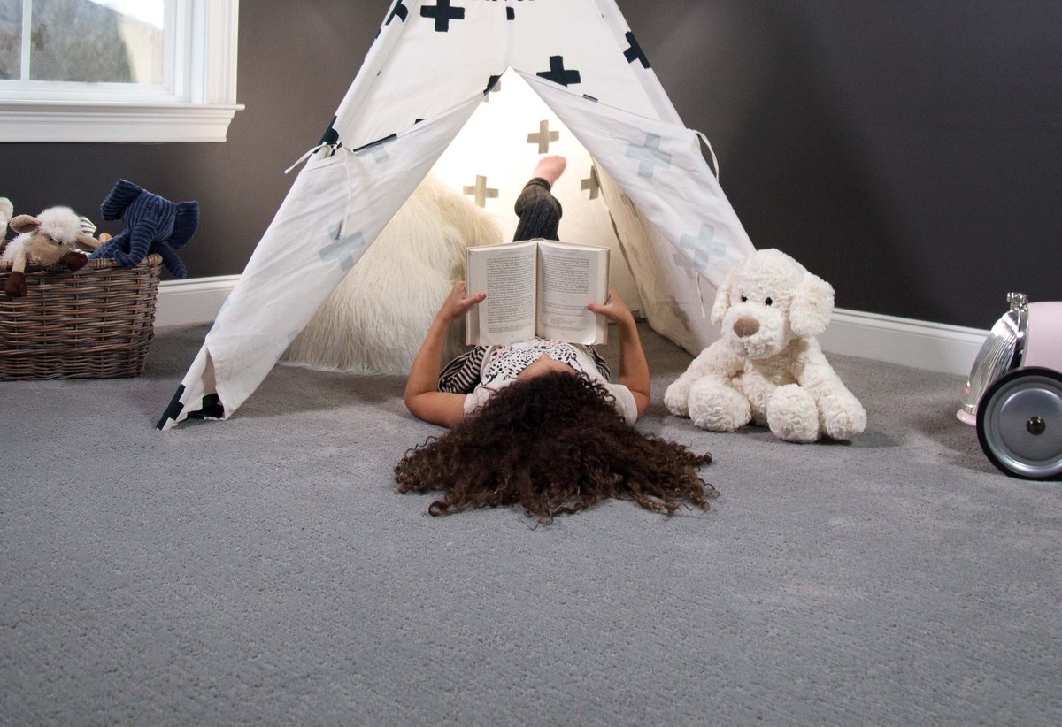 Looks like she found the coziest corner to get lost in an adventure in a faraway place. 📚 #STAINMASTER