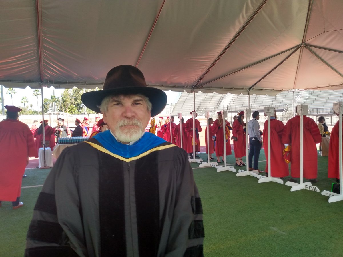 Prof Corsetti is here to hood, note the unconventional tasseled hat!