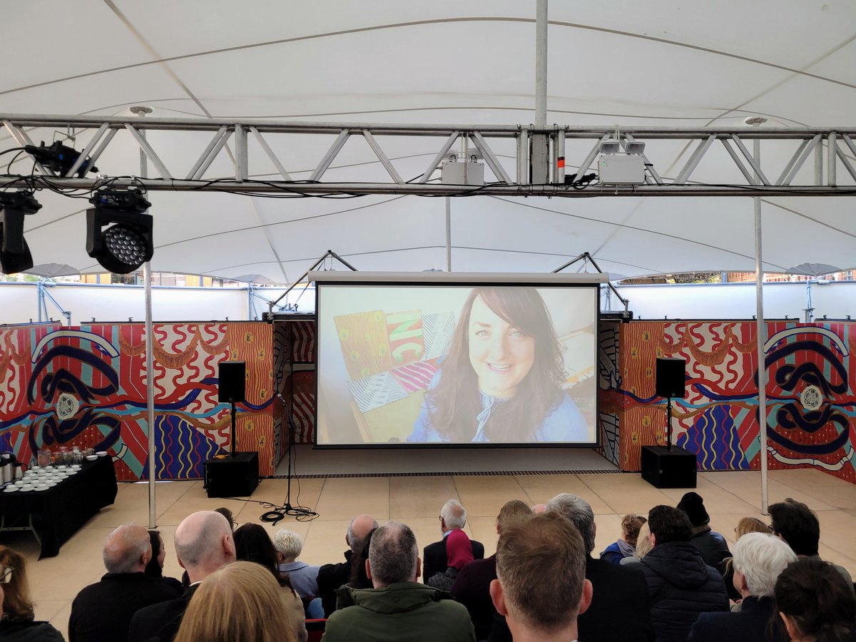 InCertainPlaces's tweet photo. Artist @jennycsteele on the big screen, talking about her creative research process for the designs on MET's interior panels, which involved working with @CarnivalPreston, Preston Black History Group, Preston Morris Dancers, the Horricks archive, @ConfuciusInst10 amongst others.. https://t.co/Gnc3dRMUjk