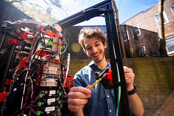 NortheasternCOE's tweet image. Engineering in Action: MIE student Ethan Holand works on the PARSEC robot that he and his teammates built for the NASA RASC-AL Moon to Mars Ice &amp;amp; Prospecting Challenge
#engineering #engineeringinaction #iamanengineer #nuexperience #nucoe #mechanicalengineering #robots