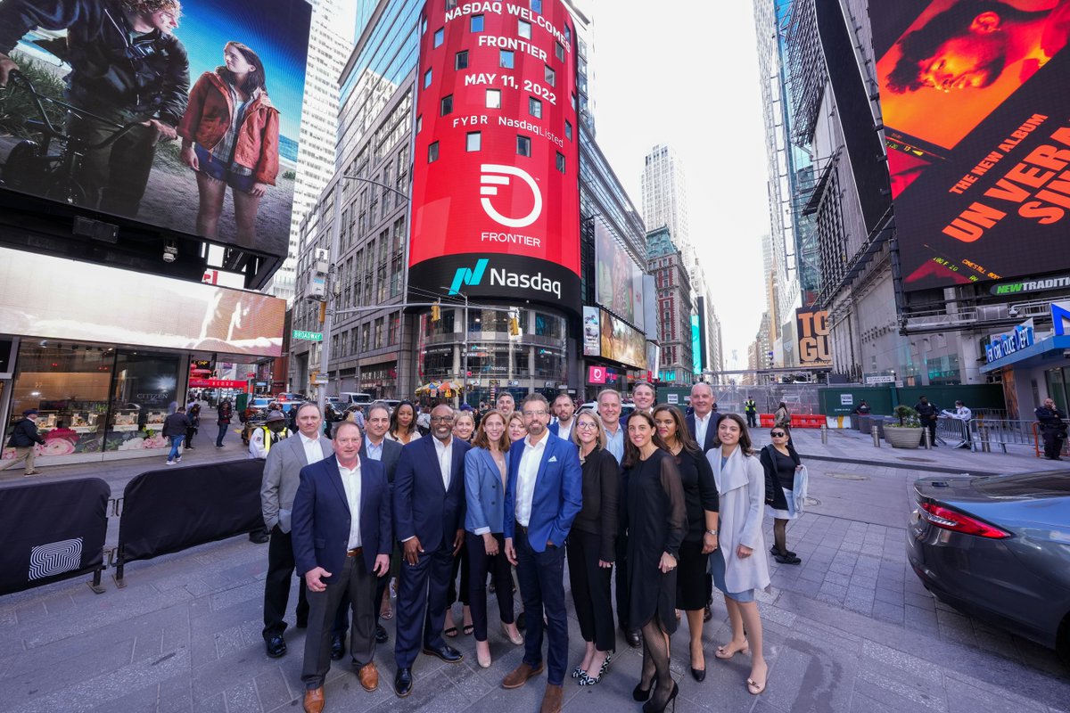 FrontierCorp's tweet photo. Our new brand lit up the seven-story tower on the @NasdaqExchange today as our executive leadership and teammates from across Frontier rang the closing bell! 🔔 What a perfect way to commemorate our one year relisting anniversary. #BuildingGigabitAmerica #LetsGoFrontier https://t.co/REuiR99kTO