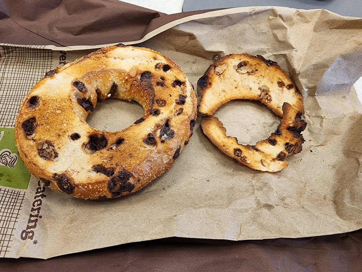 scottyadler's tweet photo. @panerabread Though technically correct a Chocolate Chip Bagel Sliced and toasted should... and this is just IMO... be a bit more evenly sliced? Unfortunately, the girl that took the order and threw it in the slicer was training a new member so that's something to look forward to https://t.co/LO7CbqlaIU
