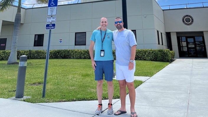 Controller Robert Morgan, left, with the passenger he helped land a single-engine Cessna safely after an unusual in-flight emergency. 