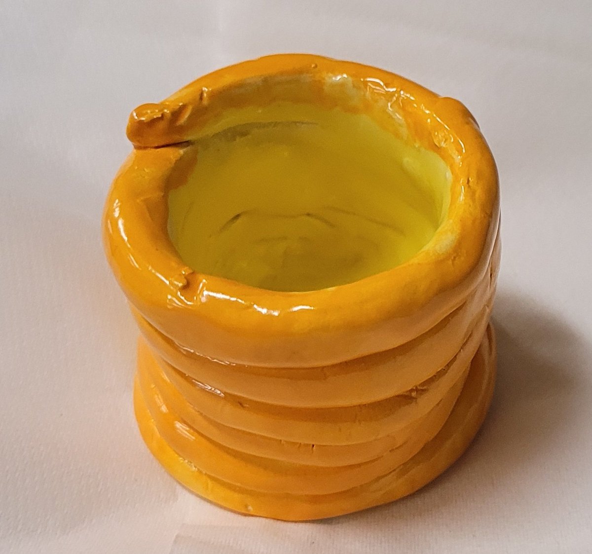 Congratulations to my Stellar Student from Bennett's Fourth Grade Class.  This student did a great job on the construction of his coil pot as well as the glazing looking good!!