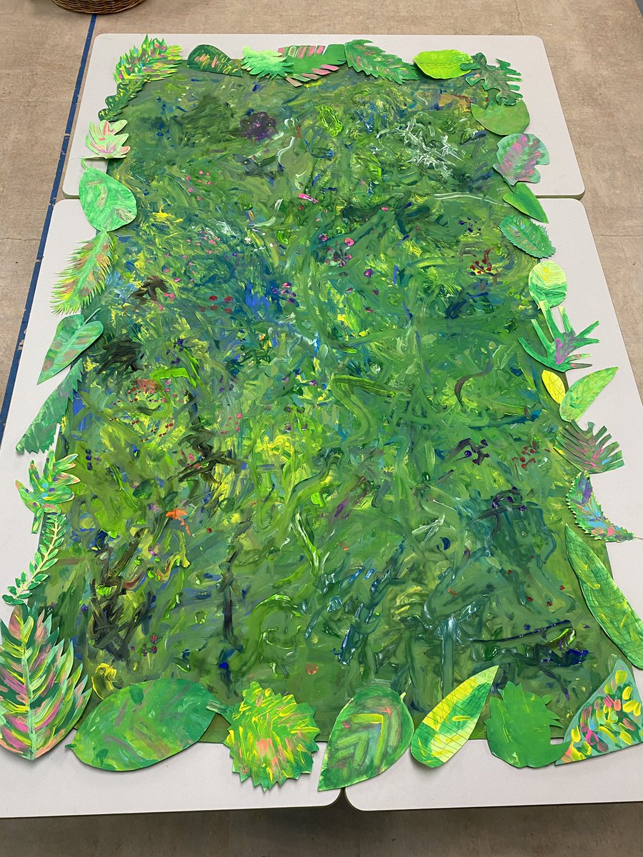 We’re preparing for our exhibition/end-of-year celebration of learning. Today we made a mural depicting the lushness of the rainforest and added previously painted leaves for the border. Leaves inspired by artist and designer Jessi Raulet @ettavee