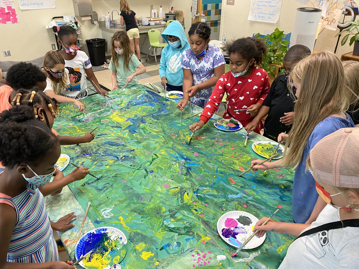 nmrickard's tweet photo. We’re preparing for our exhibition/end-of-year celebration of learning. Today we made a mural depicting the lushness of the rainforest and added previously painted leaves for the border. Leaves inspired by artist and designer Jessi Raulet @ettavee https://t.co/zp3KMdFAwH