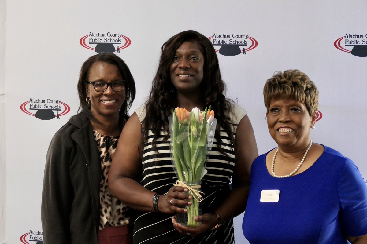 Three ladies posing for a photo